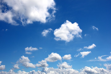 Naklejka na ściany i meble White fluffy clouds on blue sky nature background