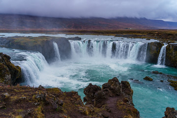Goðafoss Waterfall on a gloomy and misty autumn afternoon