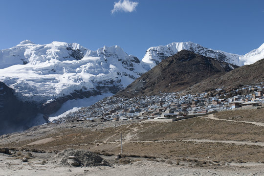 La Rinconada, Peru.  At 16,800 feet above sea level (5130m) and with a population of fifty thousand, this mining city is the highest in the world.