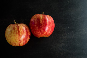 red apple on black background