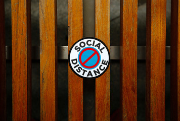Social Distance sticker on mall bench
