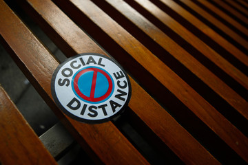 Social Distance sticker on mall bench
