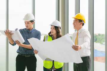 Two mans inspectors and architects discuss with head engineer about construction project.