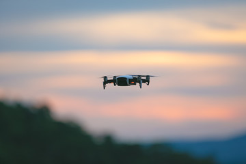 Fototapeta na wymiar Drone pilotage on the sky at sunset.
