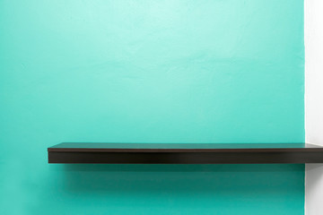 Empty white shop shelf, retail shelf on green vintage background. © jayzynism