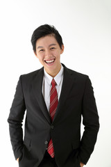 South East Asian young Chinese man wearing formal business office ware on white pose smile at camera