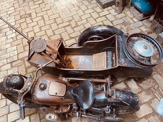 Old vintage  metal motorcycle with the gun on it