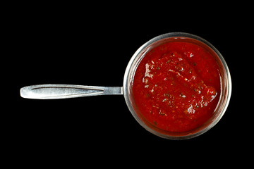 Tomato sauce in metal saucer