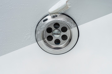 A clear example of proper bathroom care using the example of a photo before and after rinsing off the detergent