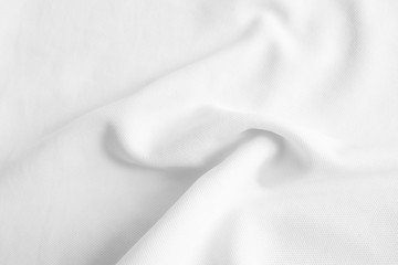 White abstract wavy clothes background. fabric texture