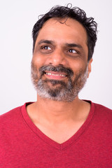 Obraz premium Portrait of happy mature handsome bearded Indian man