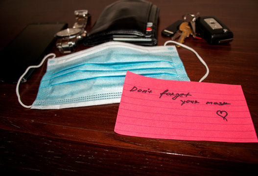 New Reality. Picture Of A Phone, Keys, Wallet, Watch Surgical Mask And Note