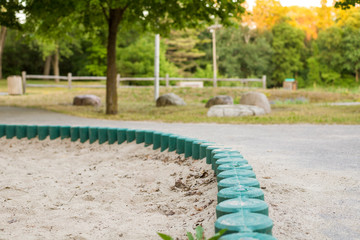 sandbox close-up in the local park without people in the evening during sunset 