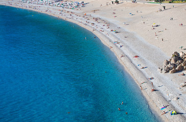 Holidaymakers sunbathing at Oludeniz beach, Fethiye,Turkey