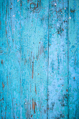 Wood texture, old boards with peeling blue paint