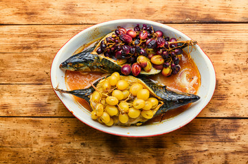 Baked fish with grape sauce