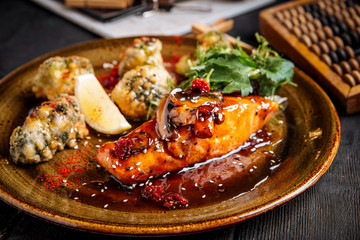 Cooked salmon fillet with fried cauliflower