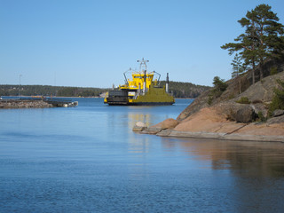 Cable ferry carrying summer habitants and tourists to archipelago at Parainen, Finland.