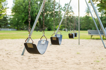 empty swing in the park playground