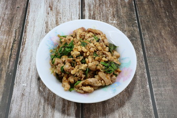 Traditional fried and stirred minced pork, chilly and basil, seasoning with fish sauce and sugar. Famous Thai spicy street food menu in Thailand. Quick and easy meal in rush hour. Comfort food. 