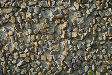 Stone wall texture background - grey stone siding with different sized stones