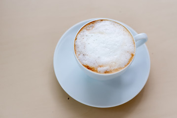 cup of coffee on wood table