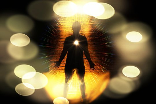 Meditating image :Human Spiritual awakening in standing pose. mindfulness illustration.Heart chakras activate and aura glow in darkness, selective bokeh lens flare effect
