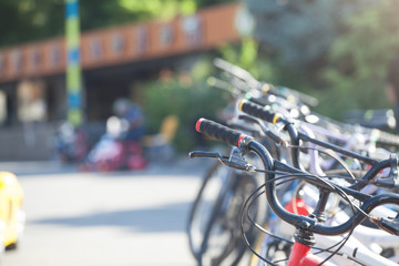 Many colorful bicycles in the city.