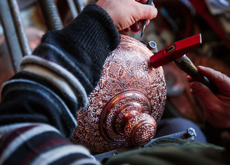 Copper master, Hands detail of craftsman at work - Gaziantep,Turkey