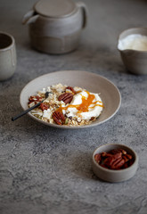 fresh oak granola with pecan nuts on concrete background