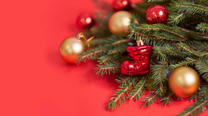 Christmas banner. Xmas design red christmas tree decorations on a red background. Horizontal christmas poster, greeting cards, headers, website.