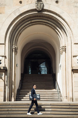 Fototapeta na wymiar Fashion man with Dj console walking on stairs