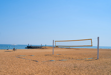 beach volleyball net hanging by the sea