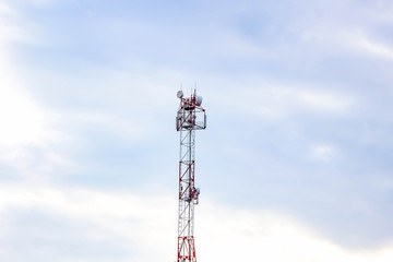 A cell tower in the distance against the sky.