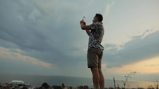 Man make mobile photo of the sea sky landscape
