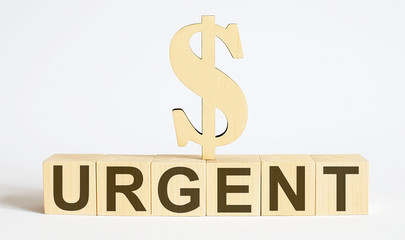 Text URGENT on wood cube block, business concept.