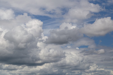 Blue sky with clouds background.