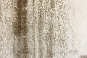 Background concrete wall, traces of weathering, worn wall damaged paint old paint. Remains of old paint on the painted concrete surface. Grungy destruction surface.