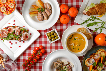 Table served for thanksgiving dinner. Autumn food on white background. Flat lay, top view, copy space