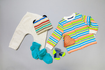 Baby concept. Baby cloth and goods on grey  background. Place for text. View from above. Flat Lay - Image