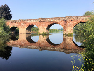 A view of Farndon Bridge with reflection