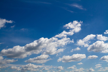 Fototapeta premium Blue sky background with white clouds