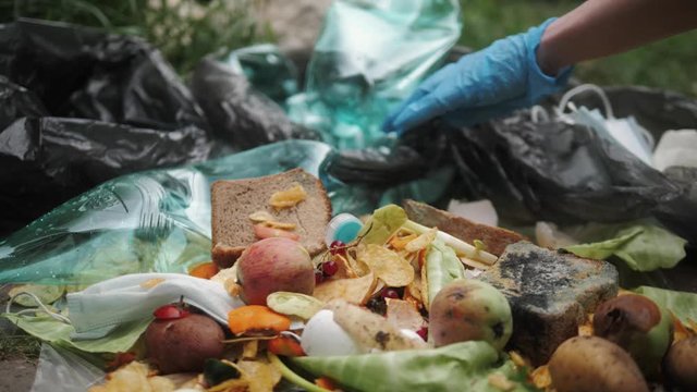 Sorting waste. plastic medical waste and food scraps. People Filling garbage bags. Separate waste collection.
