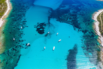 Amazing Adriatic coast in Croatia. Aerial view of azure turquoise lagoon on Sakarun beach on Dugi Otok island, yachts anchored in blue bay