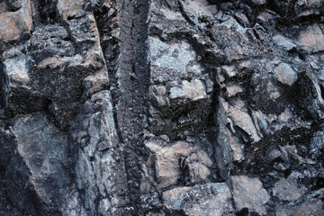 Nature of stone wall in Hong Kong mountain, construction texture detail.