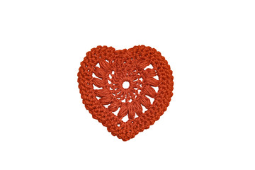 Heart knitted from red threads.