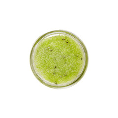 Green jam in a glass jar. Top view. Isolated object