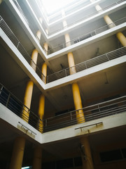 Long pillars of a building from ground to top having multiple floors.
