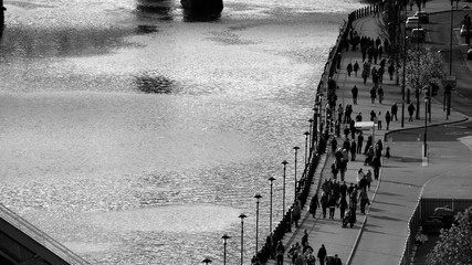 People walking along a quayside