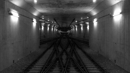 Fototapeta premium Crossover rail lines in subway tunnel